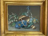 un tableau représentant une corbeille de fruits et une bouteille de vin