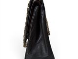 a black purse with a chain hanging from it ' s side