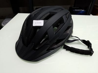 a helmet on a table with a tag on it