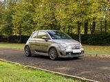 a small car that is driving down the road