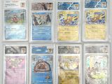 a lot of pokemon cards on the table
