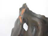 a statue of an elephant with a tag on it ' s forehead