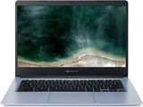 un ordinateur portable ouvert posé sur une surface blanche