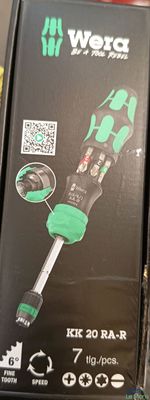 a black box with a green sticker on it