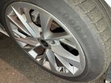 a close up of a tire on a car ' s rim