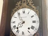 a clock that has roman numerals on the face of it