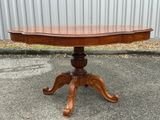 an image of a wooden table with a curved top