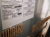 the back of a machine with wires and wires attached to it