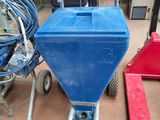 a blue cart that is sitting on the floor