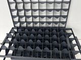 an image of a rack with a bunch of empty wine bottles