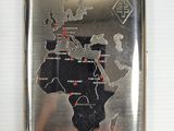 a silver cigarette case with a map of africa on it