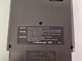 a close up of a black electronic device on a white surface