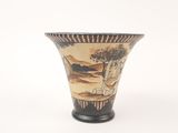 a vase with a painting on it sitting on a table