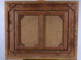 an old wooden easel with a painting on top of it