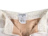 a close up of a white shirt with a lace collar