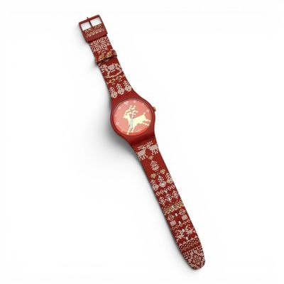une montre rouge posée sur une surface blanche