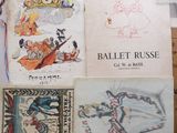 a lot of books on a table with pictures on them