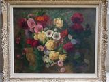 painting of a bouquet of flowers in a gold frame on a table