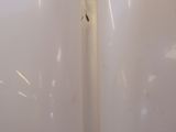 a white lamp that is sitting on a table