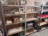 many shelves that have various items on them in the room