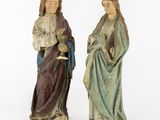two figurines of jesus and mary holding a child