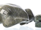 a picture of a stone elephant and some rocks