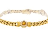 a close up of a bracelet on a white background