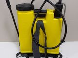 a yellow sprayer and a black hose on a white table