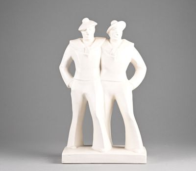 a white statue of two men standing next to each other