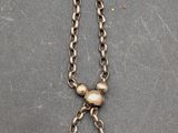 a close up of a purse with a chain attached to it