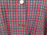 a close up of a red and blue plaid coat on a mannequin mannequin mannequin mannequin mannequin mannequin manne