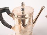 a silver coffee pot and a silver tea pot