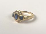 an image of a gold ring with a blue stone and diamonds