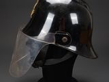 a close up of a helmet with a clear vise on it