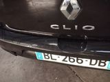 a close up of a black car with a license plate on it