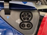 a close up of a car ' s interior with an electric plug