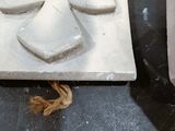 someone is making a face out of clay on a table