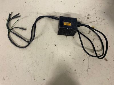 a small electrical device that is on the floor