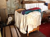 an image of a messy room with a bed and suitcases