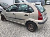 a small car that is parked in a parking lot