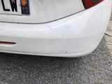 a white car parked on the side of the street