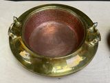 a bowl and a plate sitting on a table next to each other