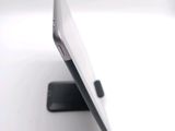 a close up view of a cell phone on a stand