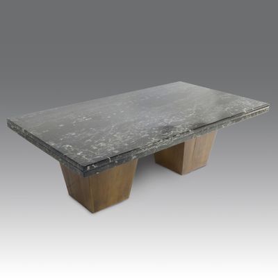 an image of a black marble table with two wooden legs
