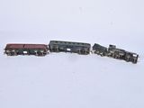 a toy train that is on the tracks in the snow
