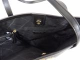 the inside of a black handbag with a zipper on it