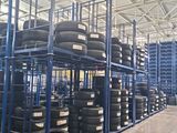 a lot of tires on the shelves in the warehouse