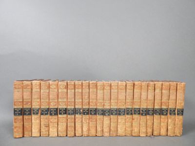 a set of twelve books on a grey background