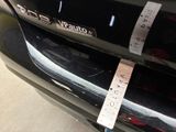 a close up of a car with a tape on it ' s bumper
