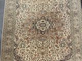 an antique persian rug with a large medallion design